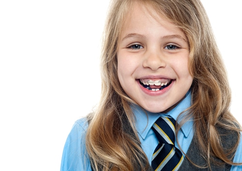 Young girl in school uniform smiling with braces – Basking Ridge and Mendham, NJ – Banasiak & Nettune