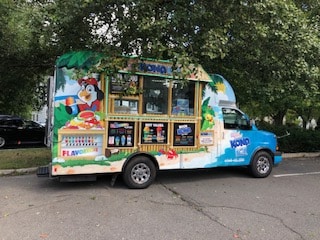 Decorative orthodontic truck parked for community outreach Basking Ridge and Mendham, NJ - Banasiak & Nettune