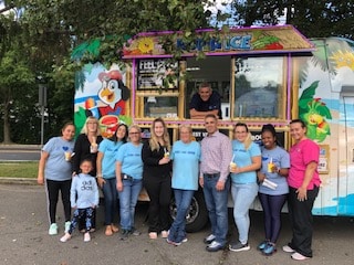 Team photo in front of dessert truck at orthodontic celebration Basking Ridge and Mendham, NJ - Banasiak & Nettune