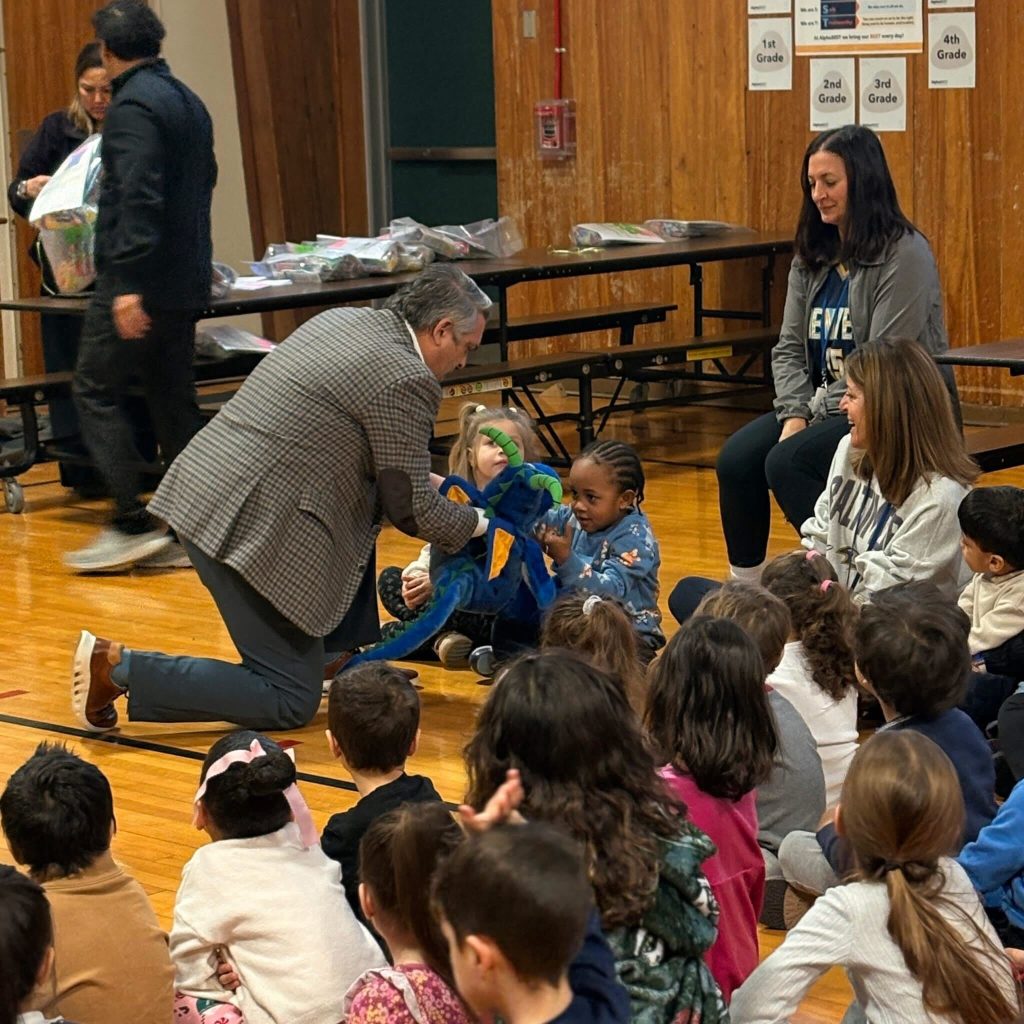 Dentist, Dr. Kenneth Banasiak teaching children about proper oral hygiene and healthy eating habits